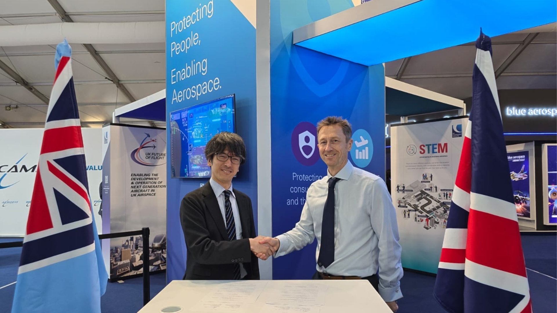 Rob Bishton (right) meeting with Makoto Eguchi (left)