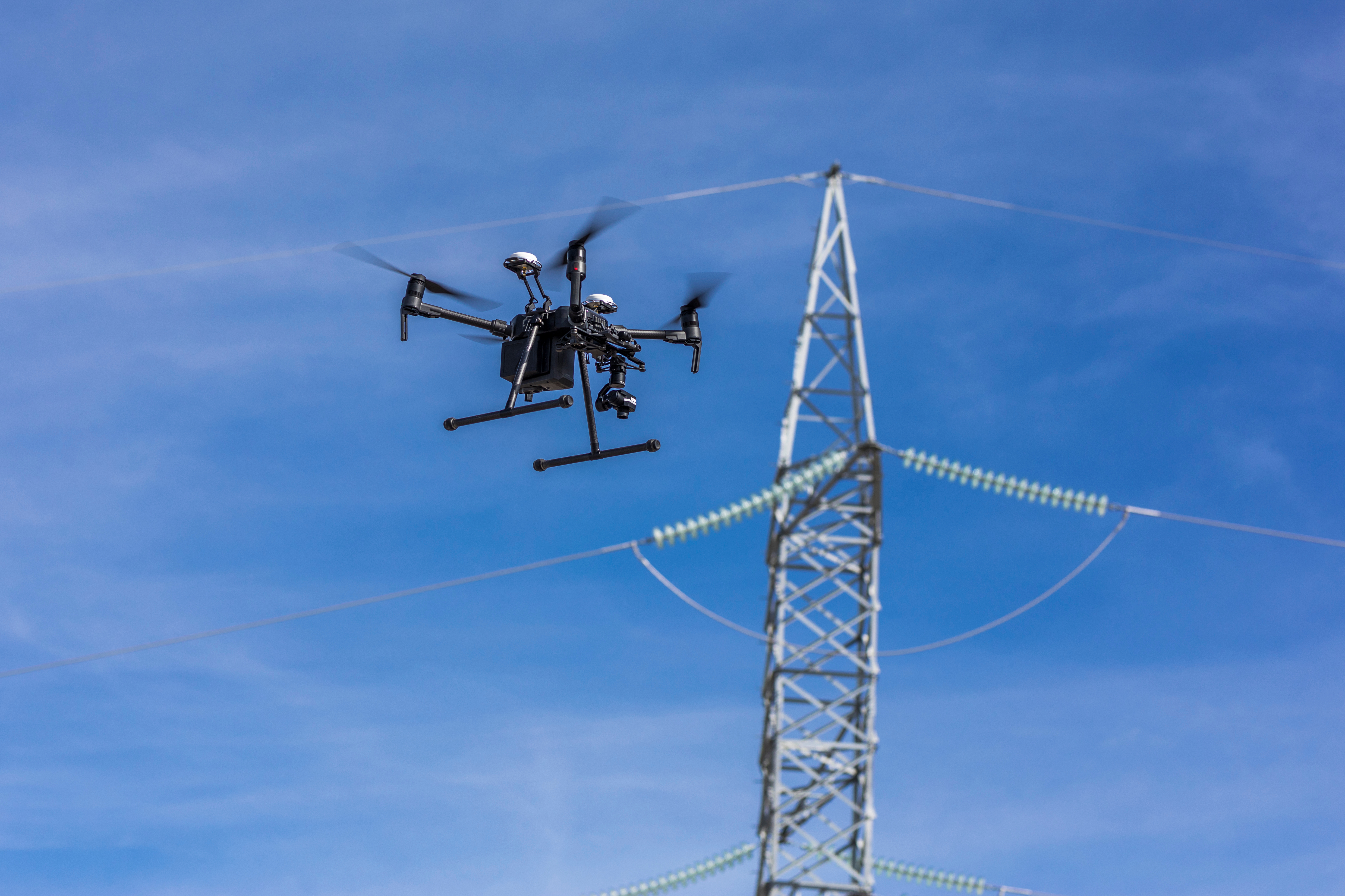 Drone inspecting a power line